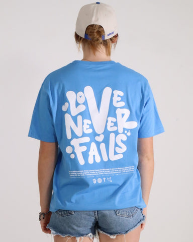 LOVE NEVER FAILS TEE BLUE