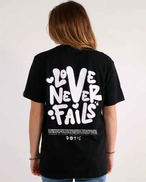 LOVE NEVER FAILS TEE BLACK