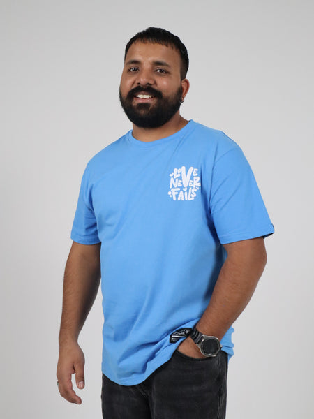 LOVE NEVER FAILS TEE BLUE