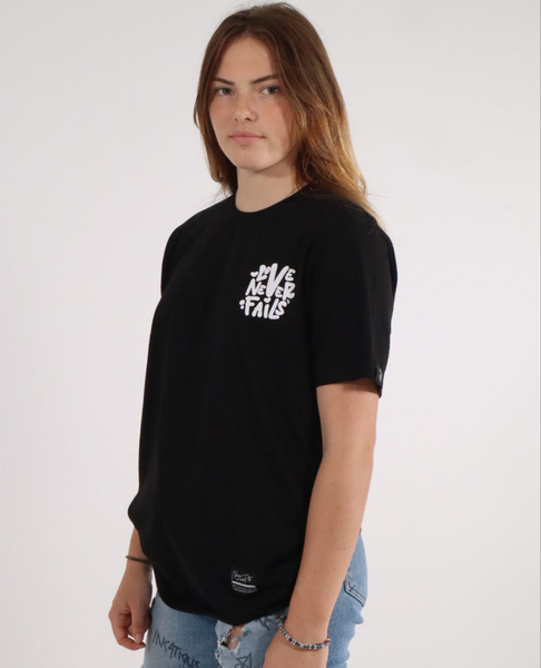 LOVE NEVER FAILS TEE BLACK